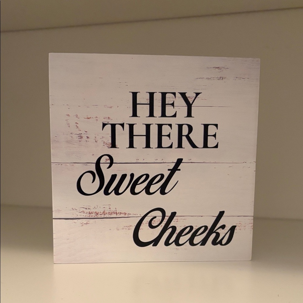 White Decorative Sign with Black Text